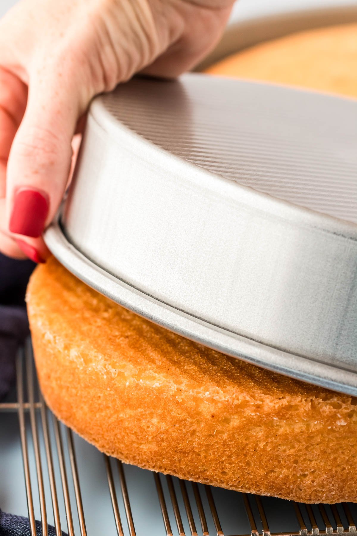 A cake coming out of a cake pan.