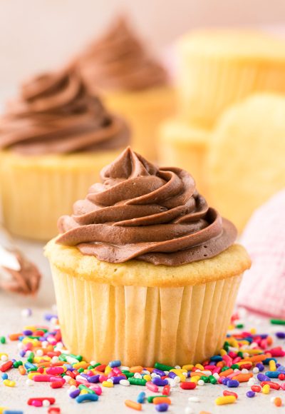 Chocolate Cream Cheese Frosting on a yellow cupcake.