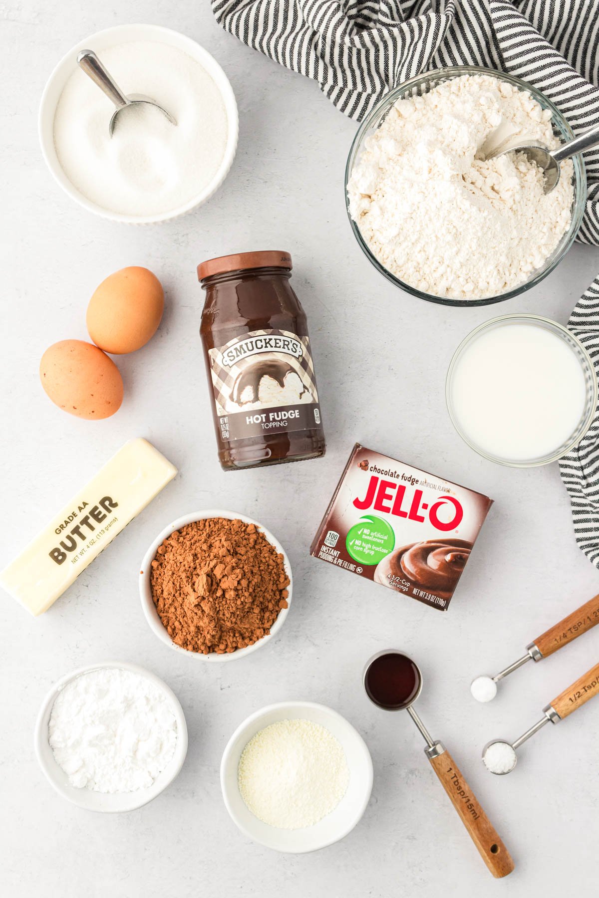 Ingredients to make lava cake cookies on a white counter.