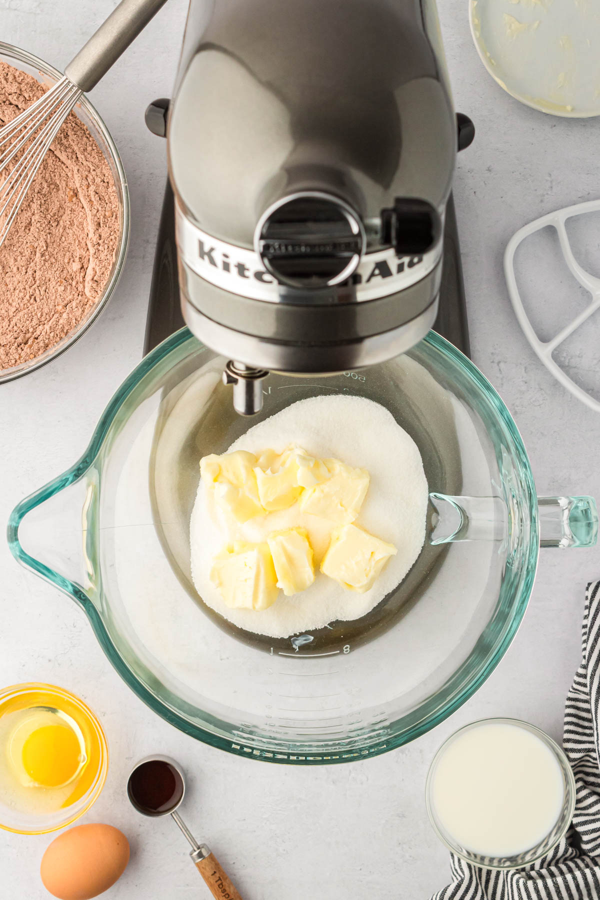 Butter and sugar ready to be creamed together in a glass stand mixer. 