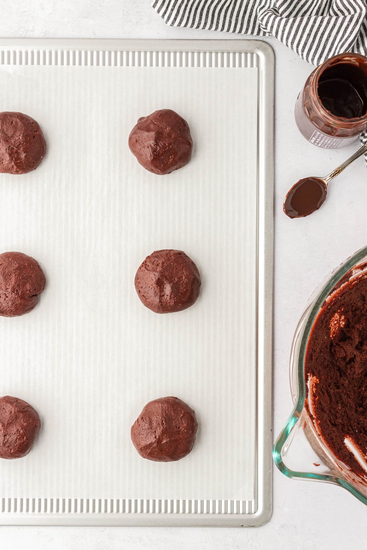 Chocolate lava cookies on a cookie sheet ready to be baked.