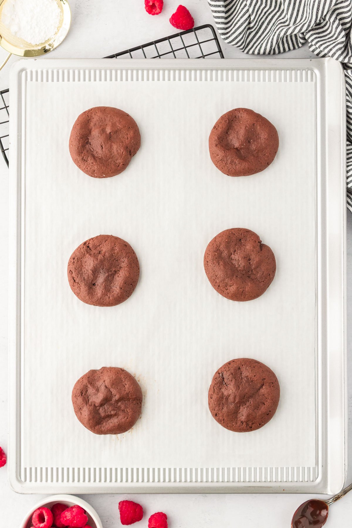 Chocolate cookies on a baking sheet. 