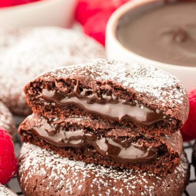 Close up of two halves of a lava cake cookie on another cookie.