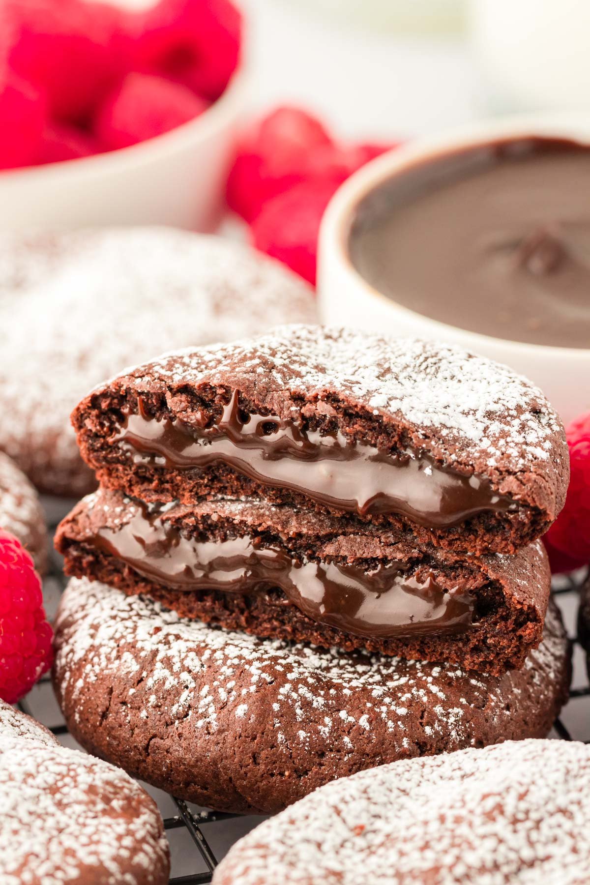 Close up of two halves of a lava cake cookie on another cookie.