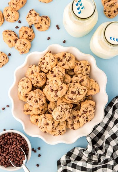 Overhead photo of a white bowl filled with mini chocolate chip cookies.