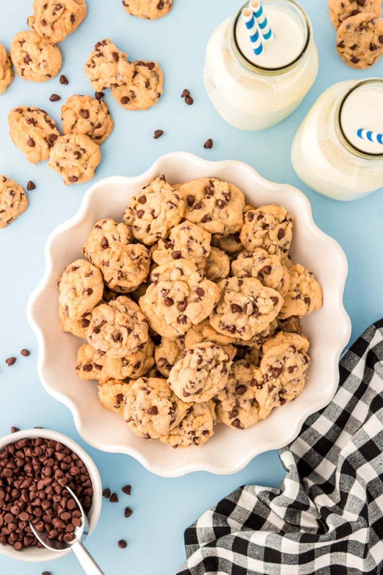 Overhead photo of a white bowl filled with mini chocolate chip cookies.