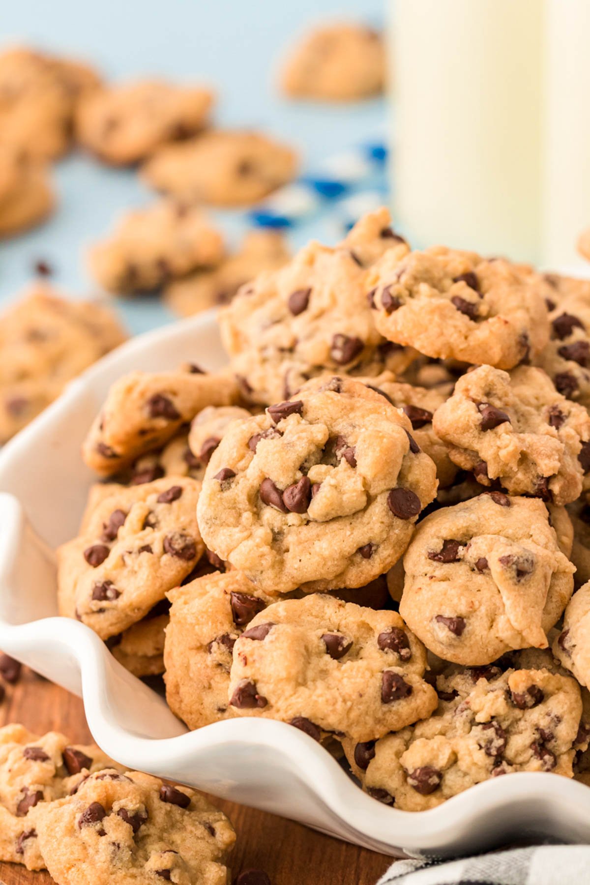A bowl filled with mini chocolate chip cookies.