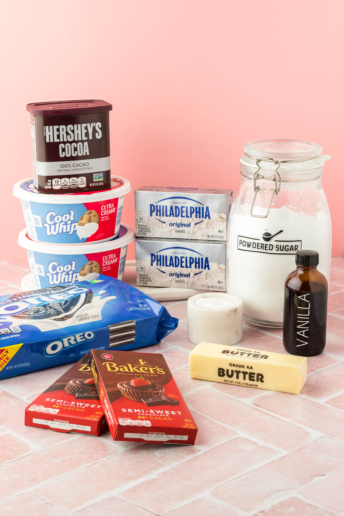 Ingredients for no-bake chocolate cheesecake on a table.