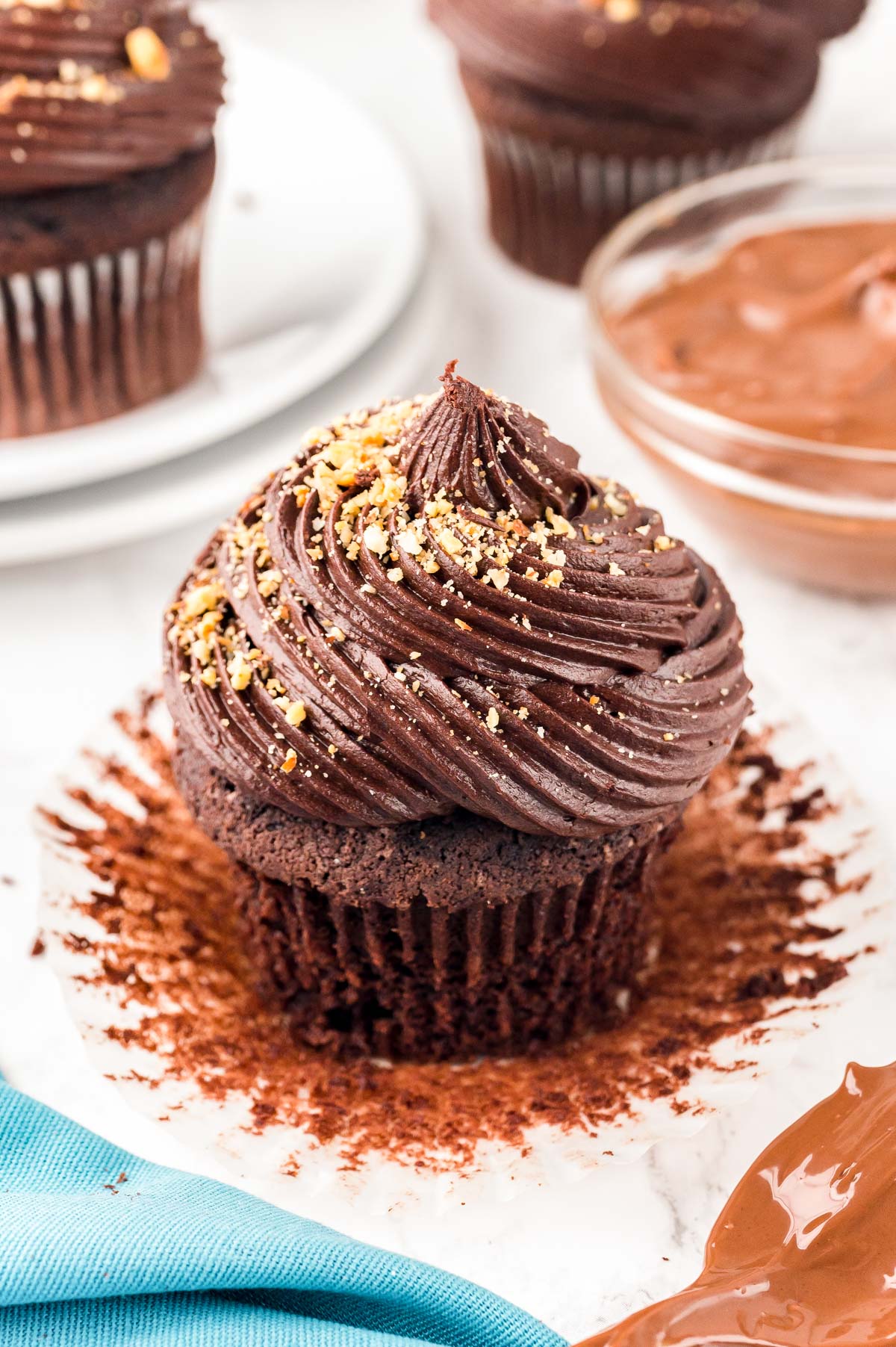 Close up of a chocolate hazelnut cupcake on a counter.