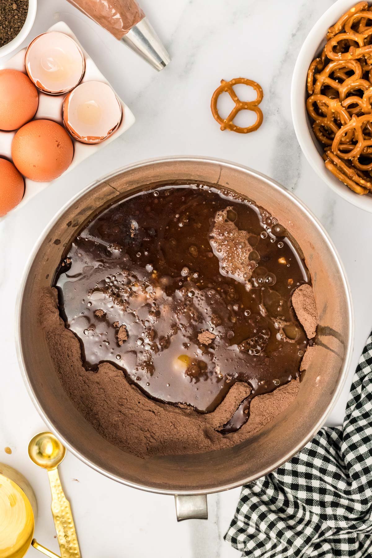 Chocolate cupcake batter being made in a bowl.