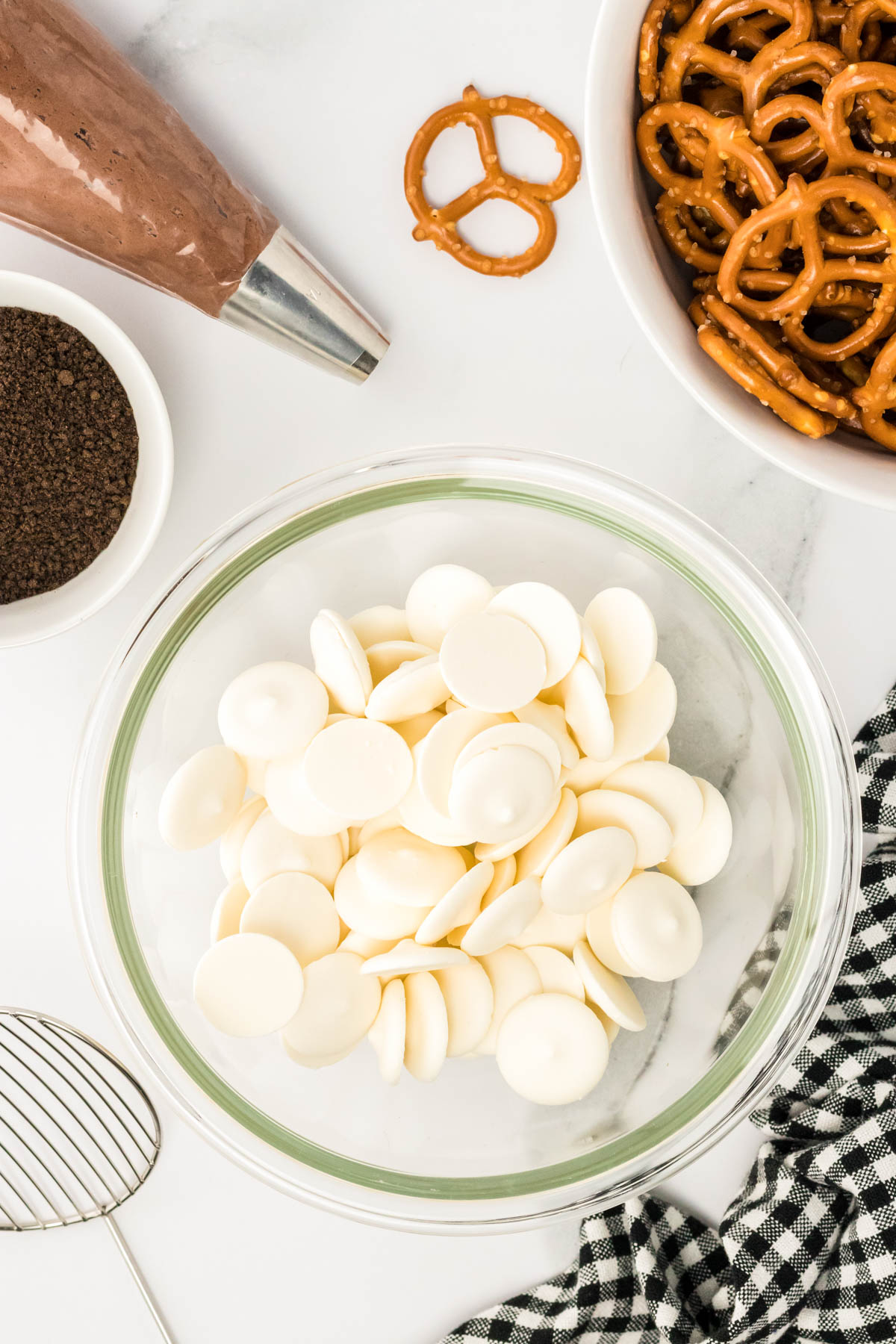 White melting wafers in a glass mixing bowl.