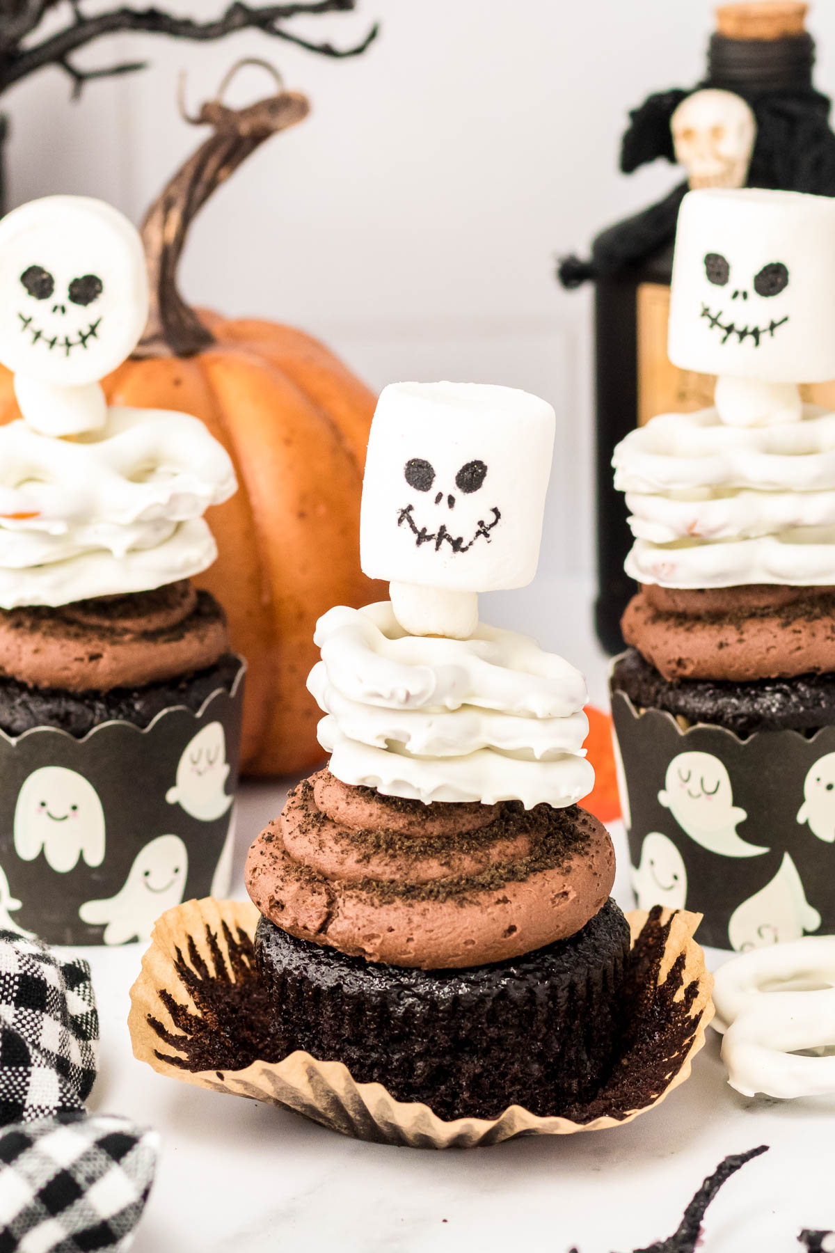 Close up of Halloween Cupcakes decorated like skeletons.
