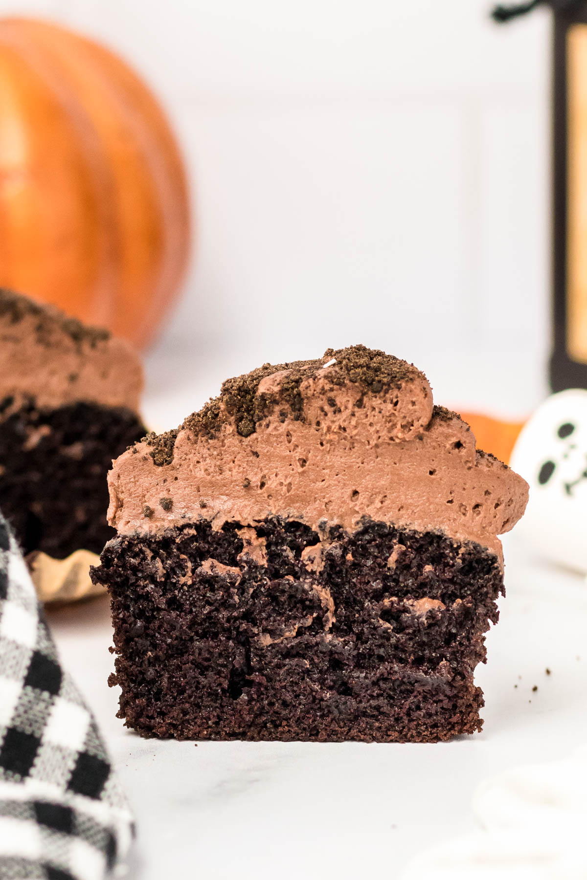 A chocolate cupcake cut in half to show the texture.