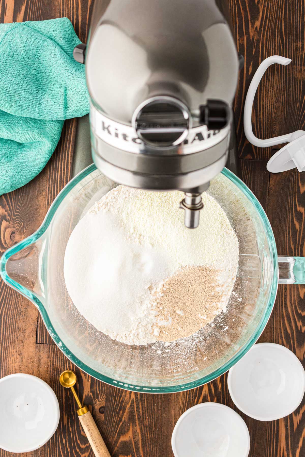 Dry ingredients to make cinnamon rolls in a mixing bowl.