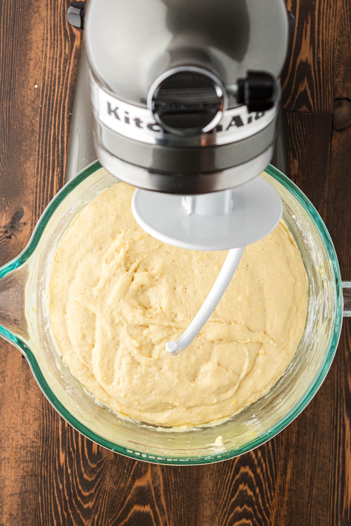 Cinnamon rolls in a stand mixer bowl ready to be kneaded.