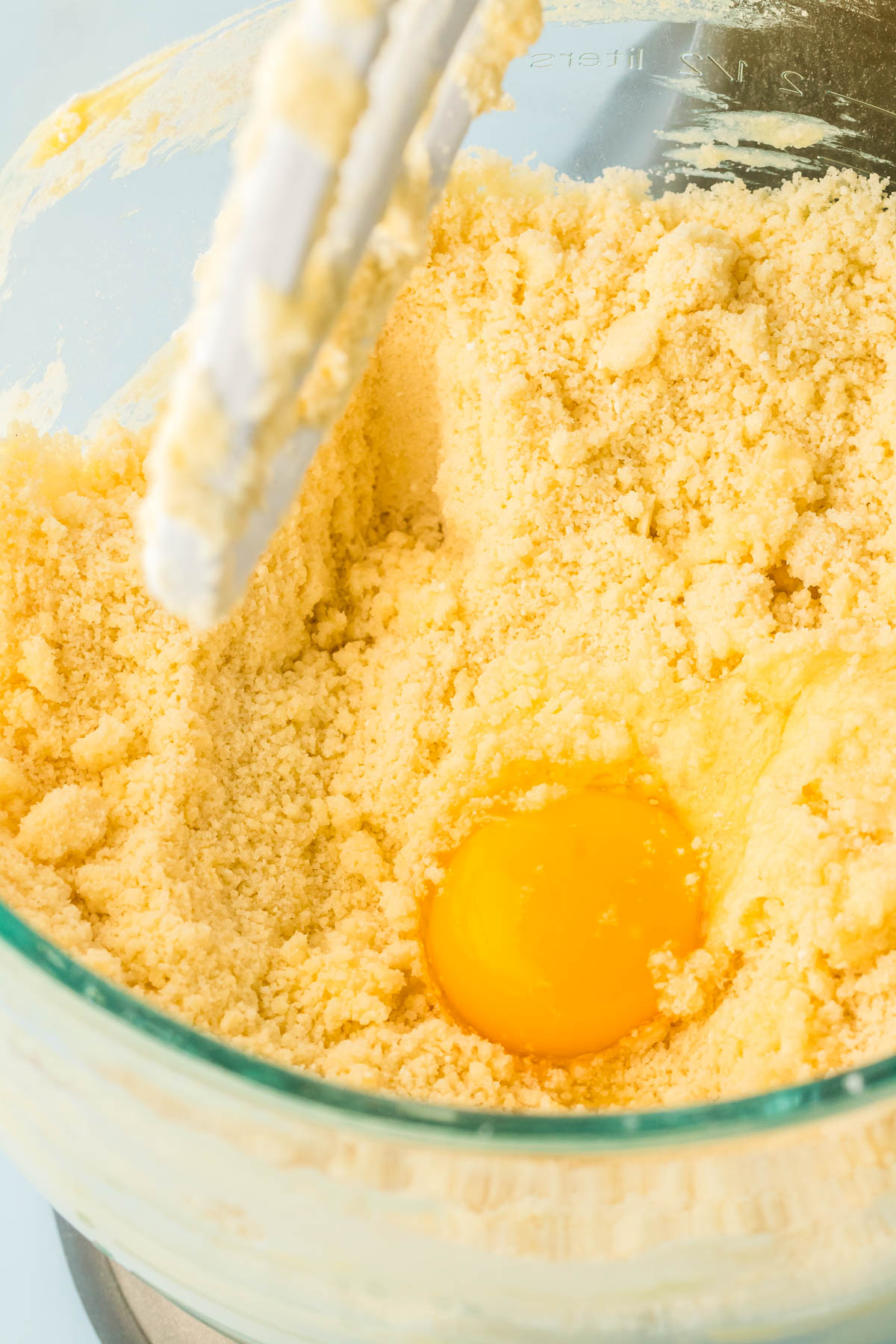 Egg being added to cake mix.