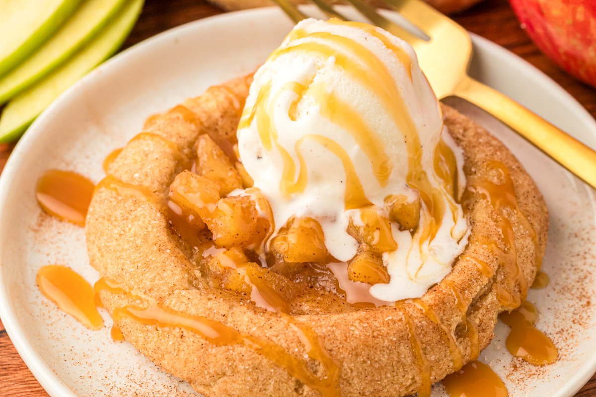 Apple pie cookies with ice cream on a plate.