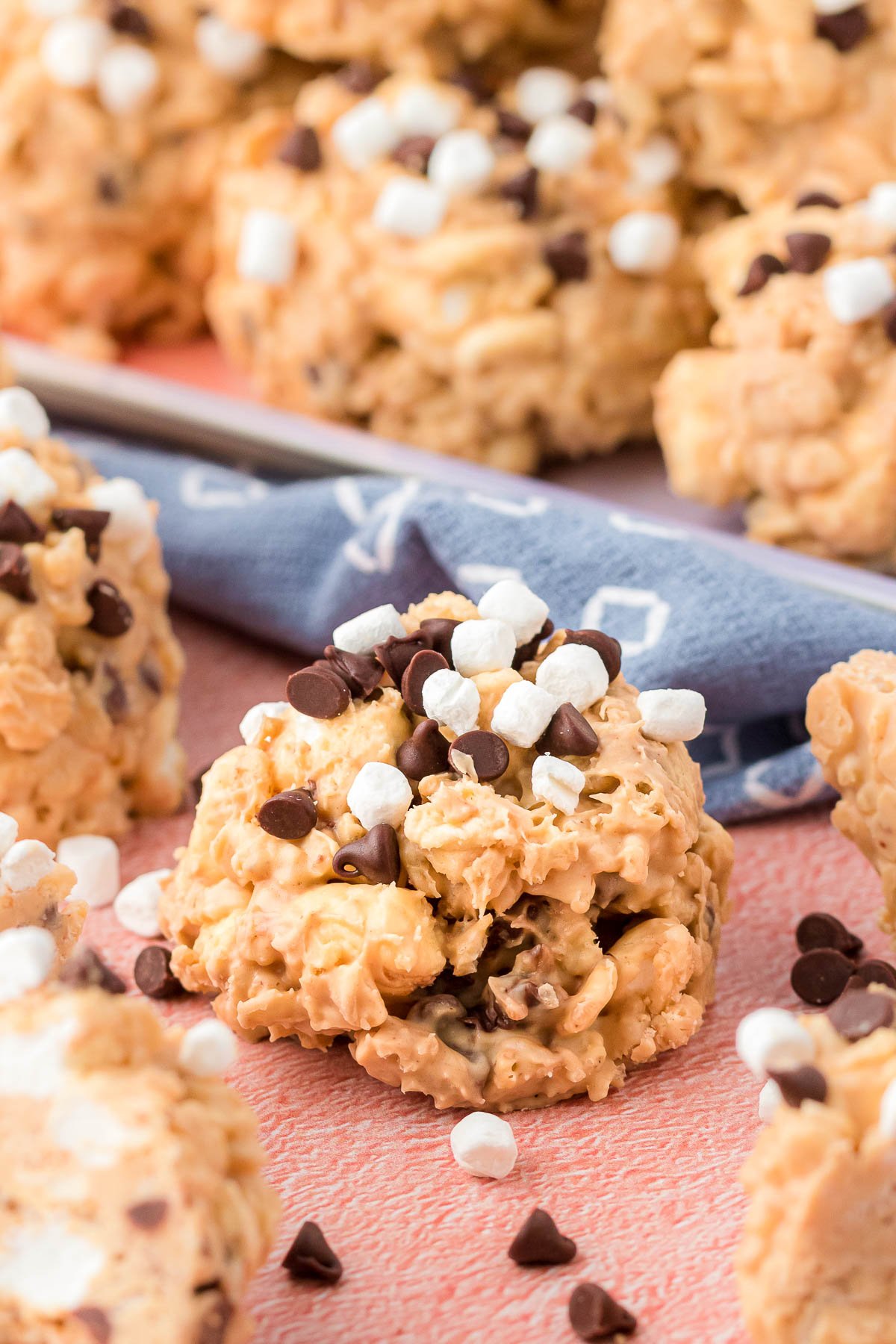 Close up of avalanche cookies on a pink surface.