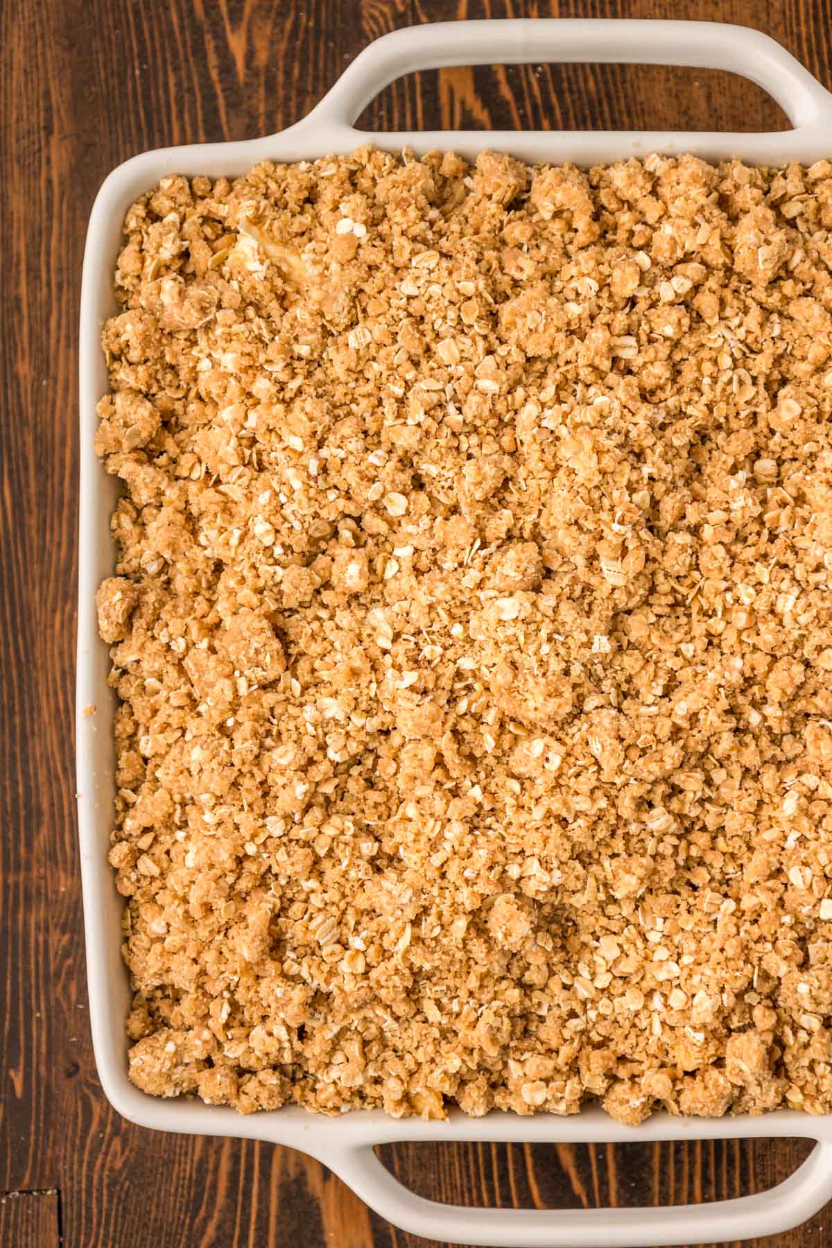 Apple crisp in a baking dish ready to bake.