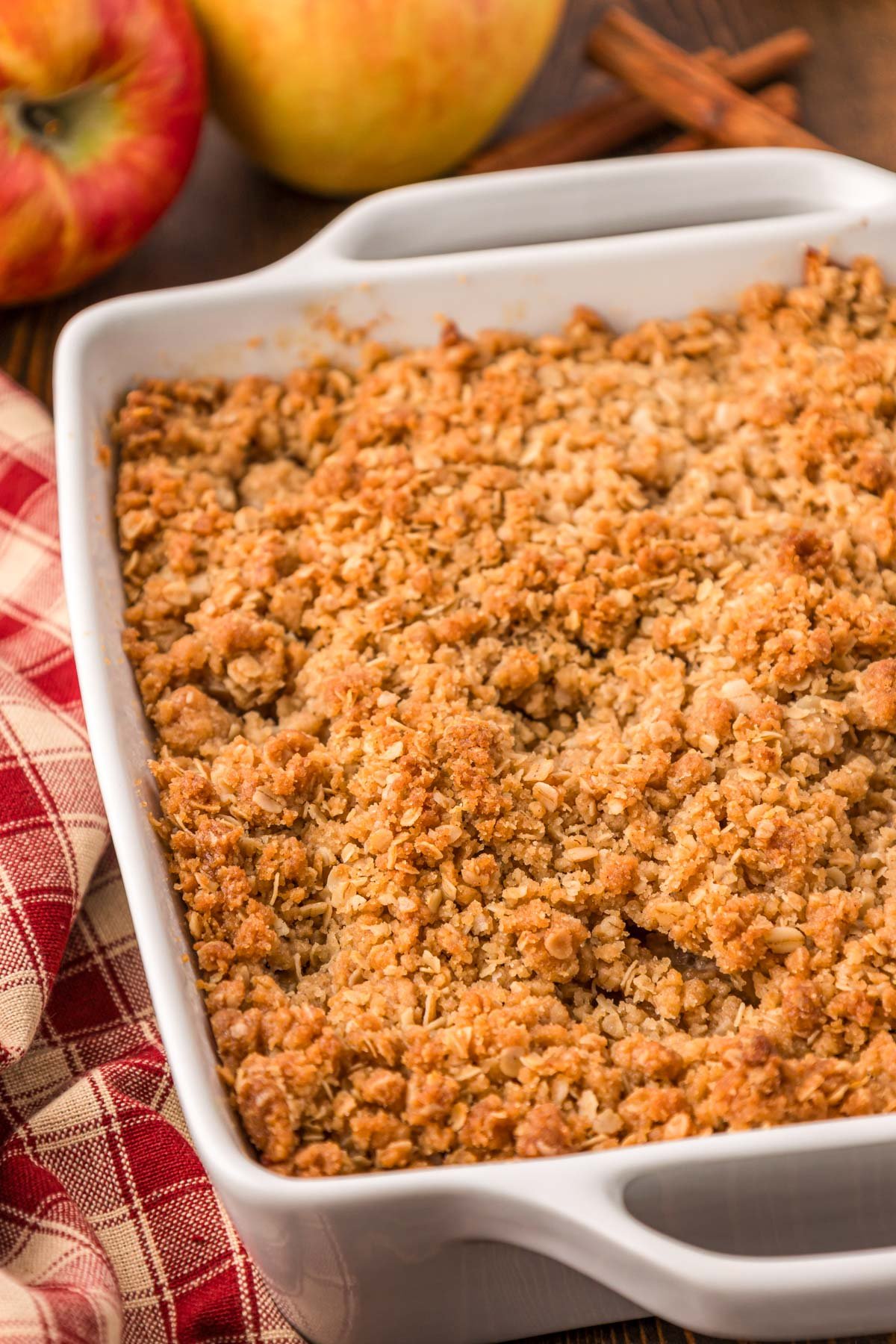 Apple Crisp in a white baking dish on a table.