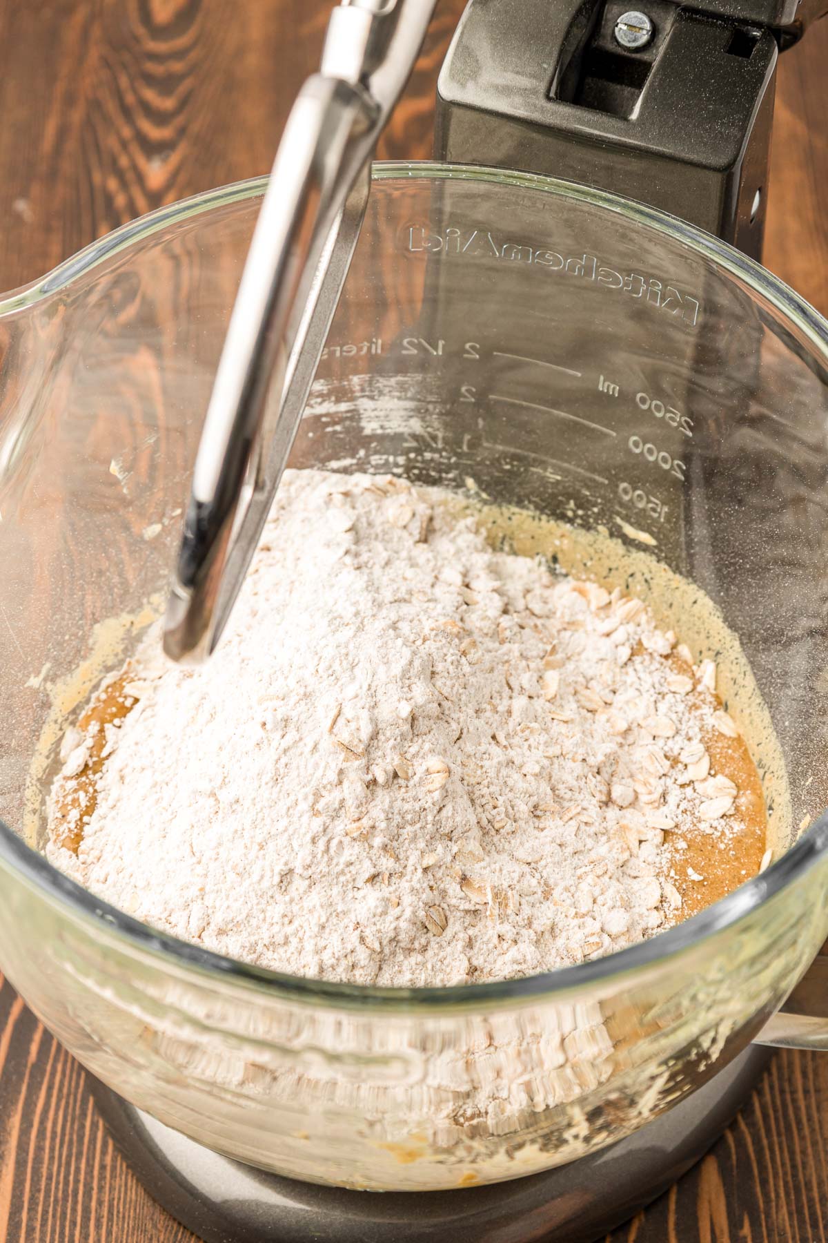 Dry ingredients being added to wet ingredients to make cookie dough.