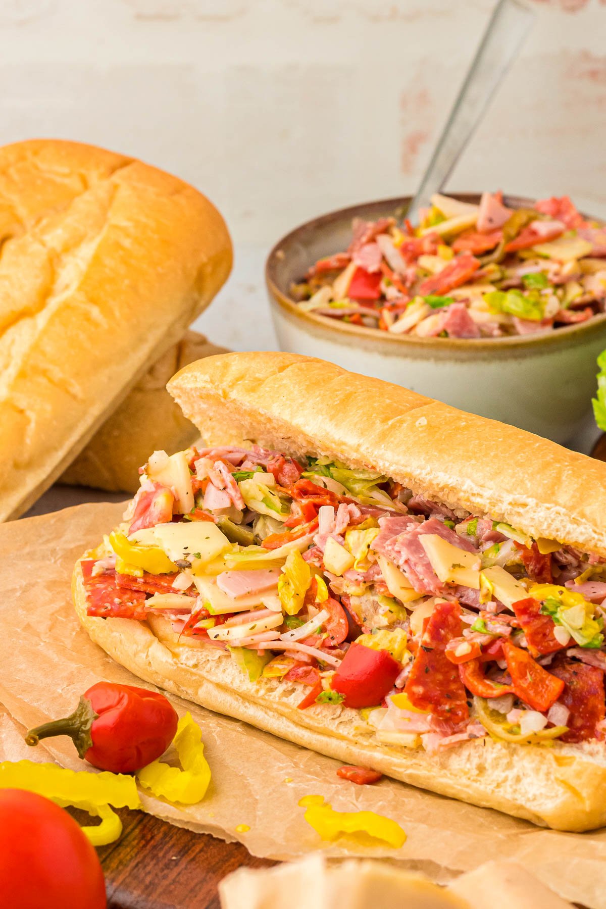 A chopped Italian Sub on a cutting board.