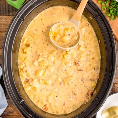 Overhead photo of a slow cooker filled with creamy potato soup.
