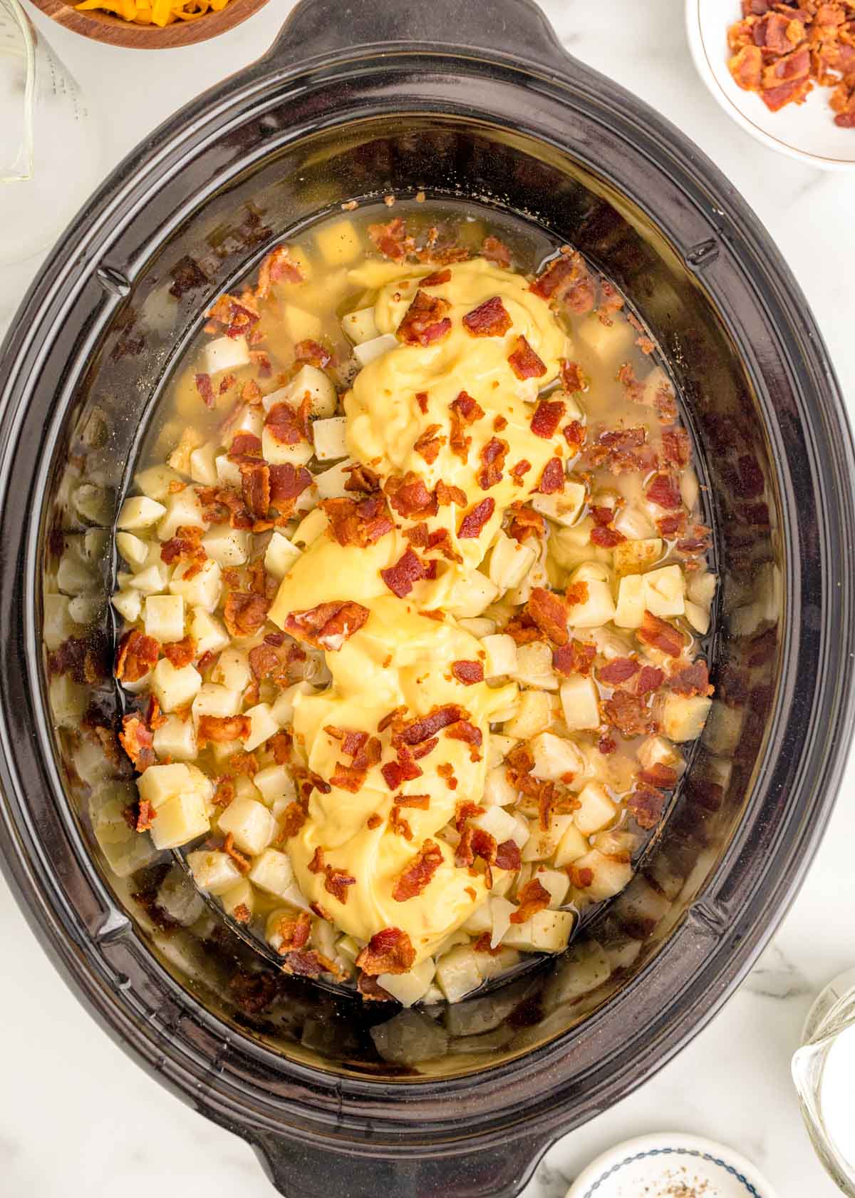 Ingredients to make potato soup in a slow cooker.