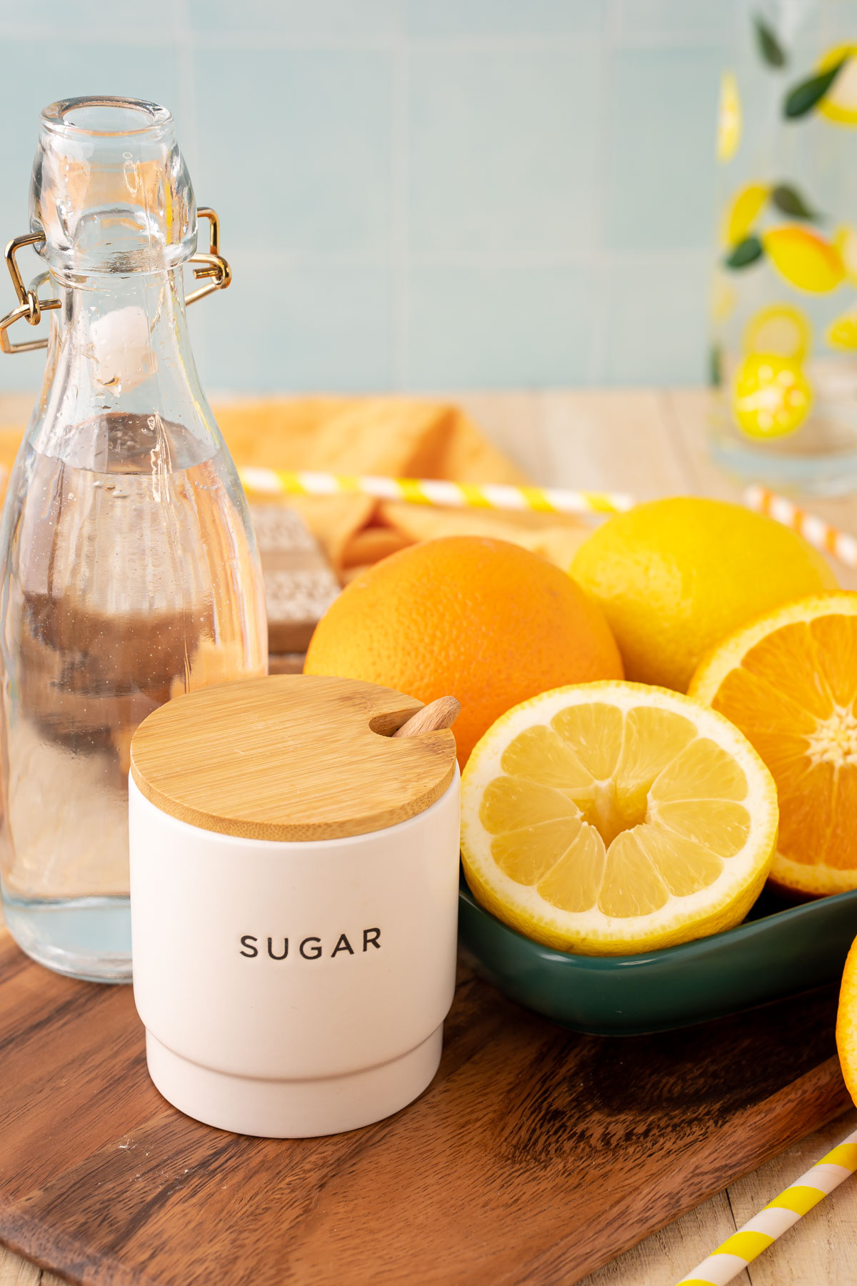 Ingredients to make orangeade on a wooden table.