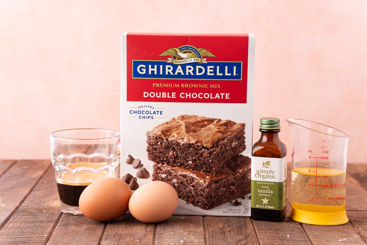 Ingredients to make box brownies (even better) on a wooden table.