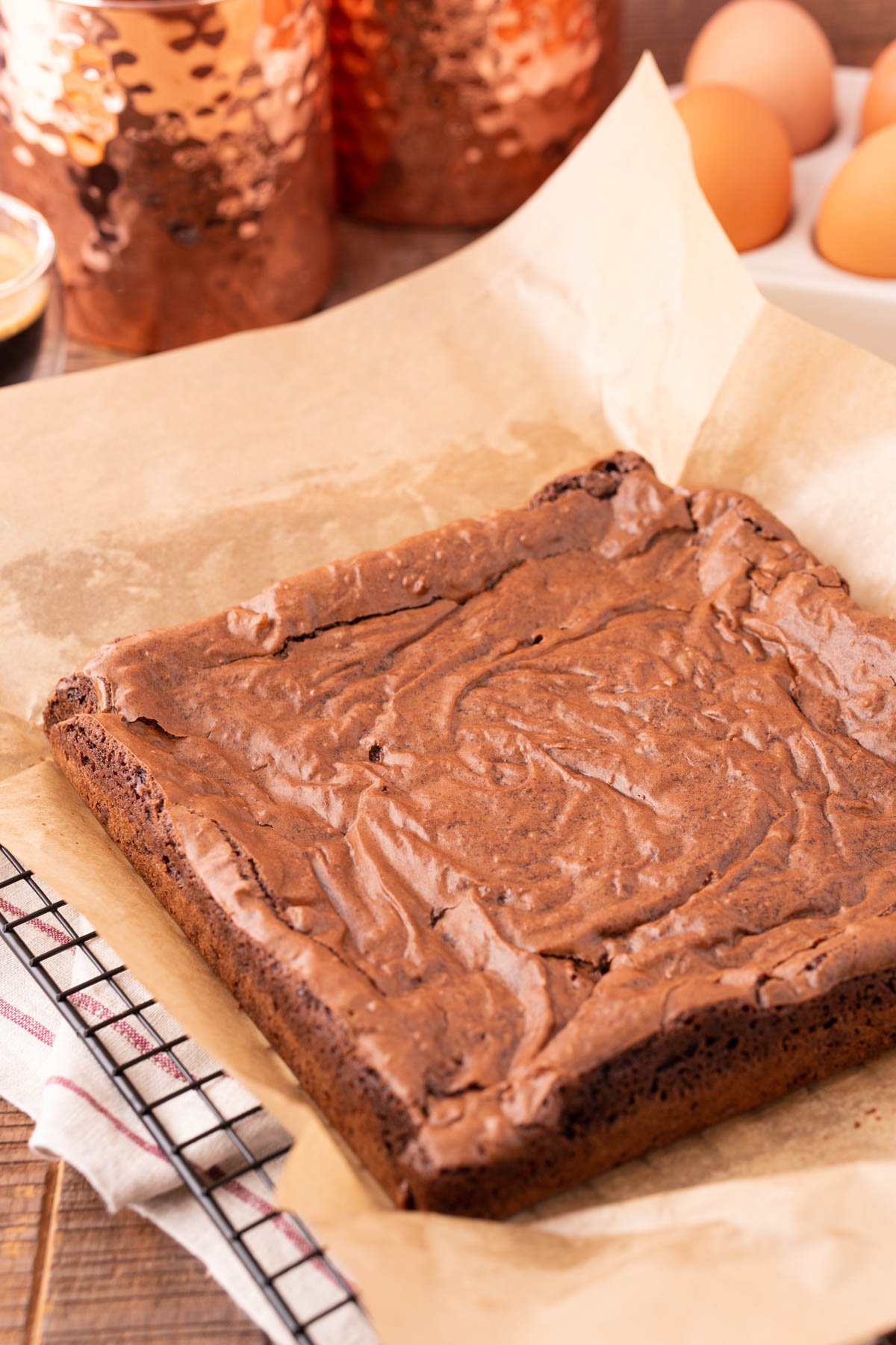 Brownies on a piece of parchment fresh out of the oven.