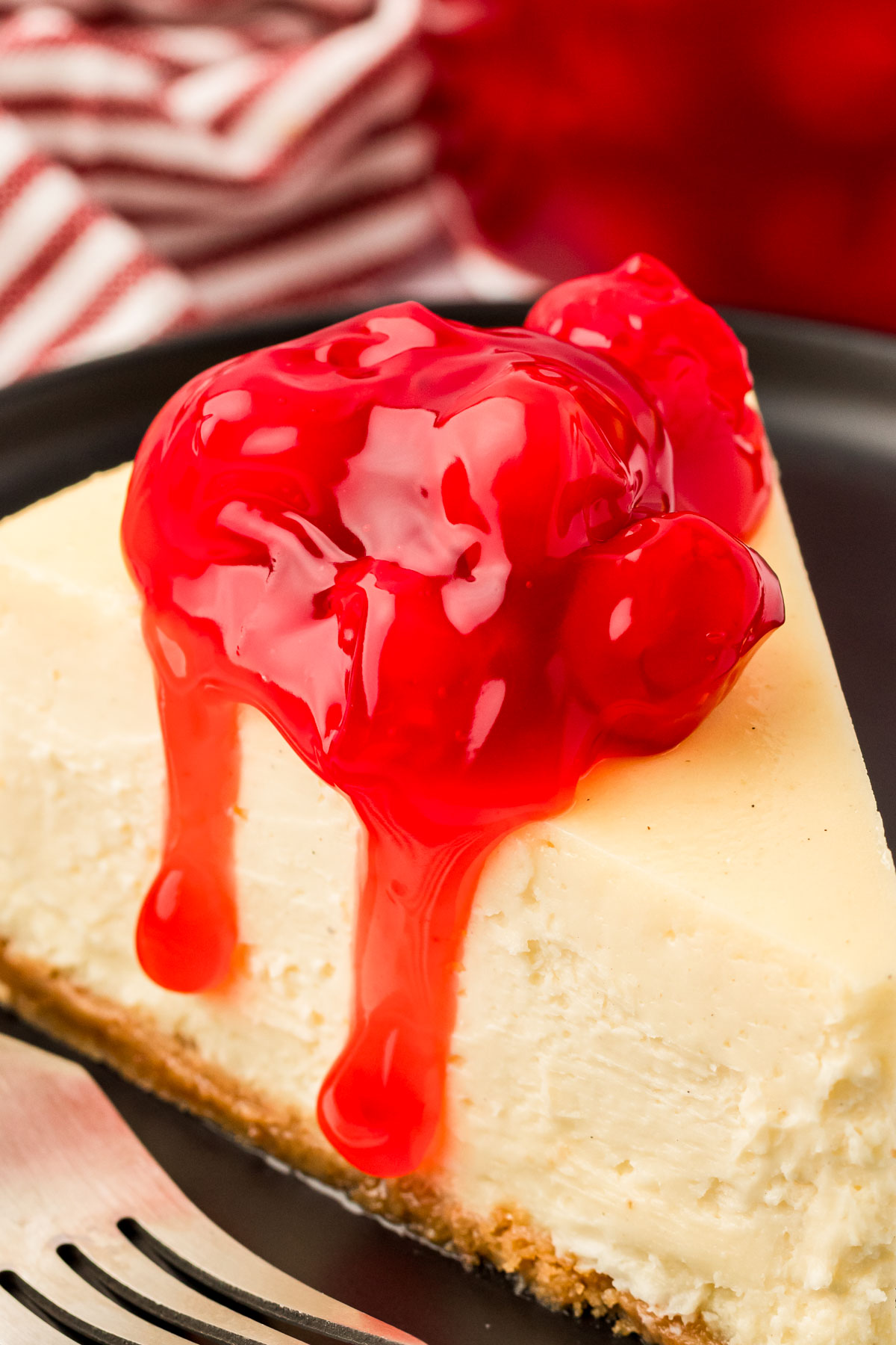 Close up of cherry topped cheesecake.
