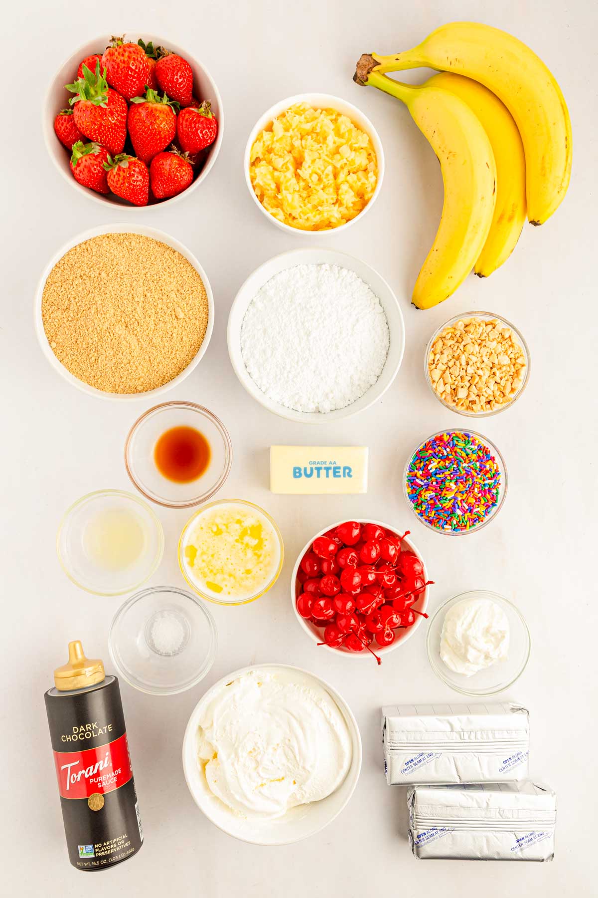 Overhead photo of ingredients to make banana split cake on a table.