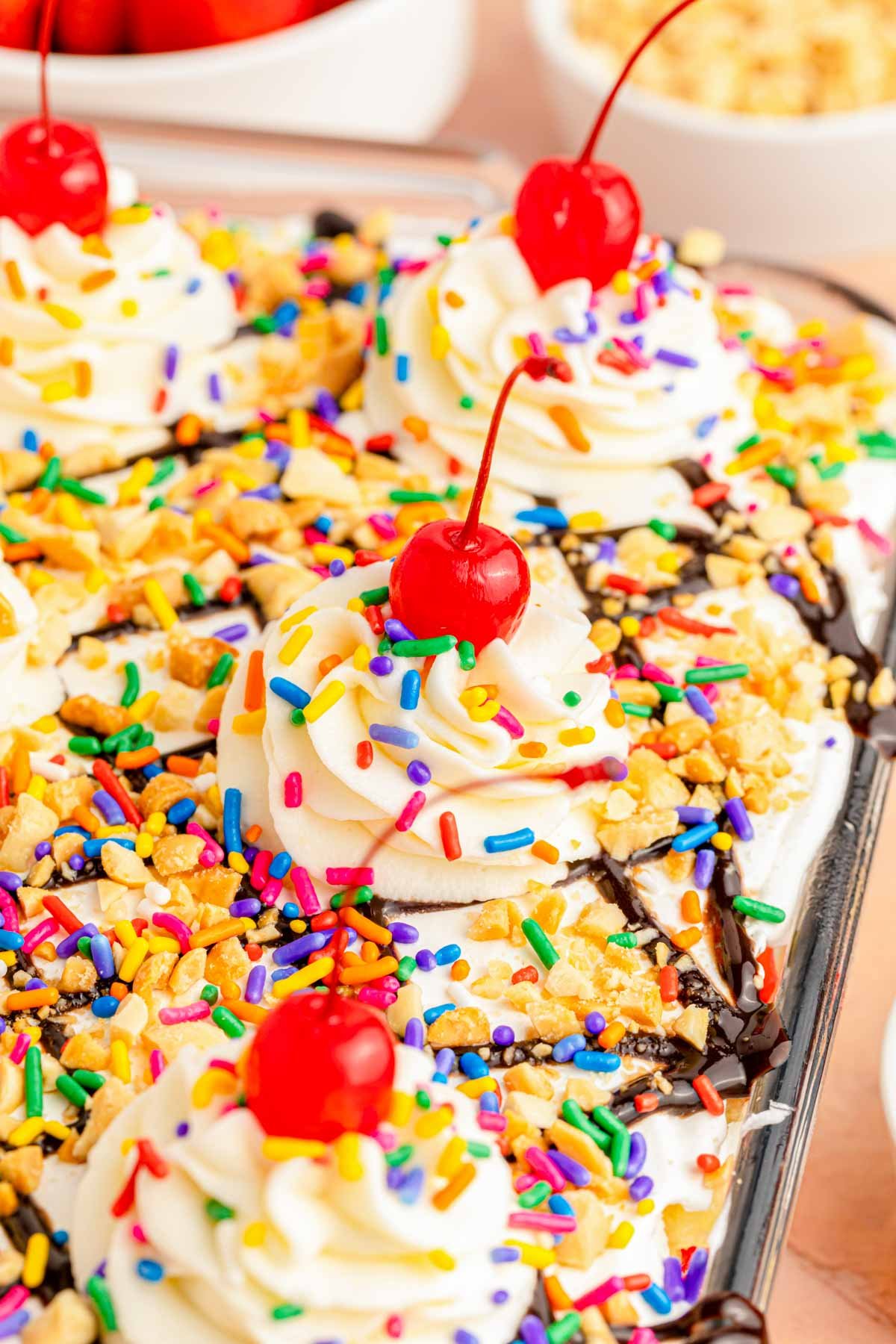 Close up of banana split cake in a glass baking dish.