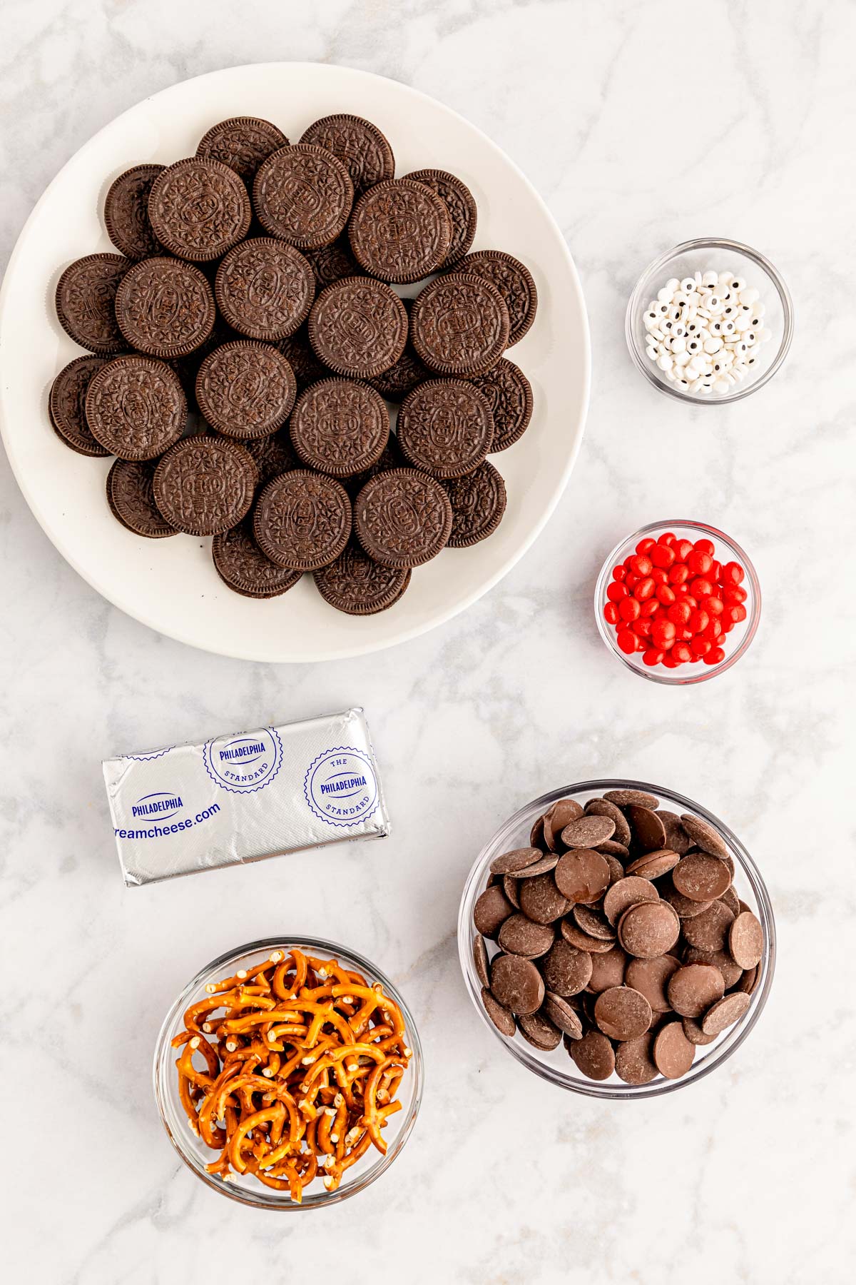 Overhead photo of ingredients on a marble counter to make Oreo Balls.