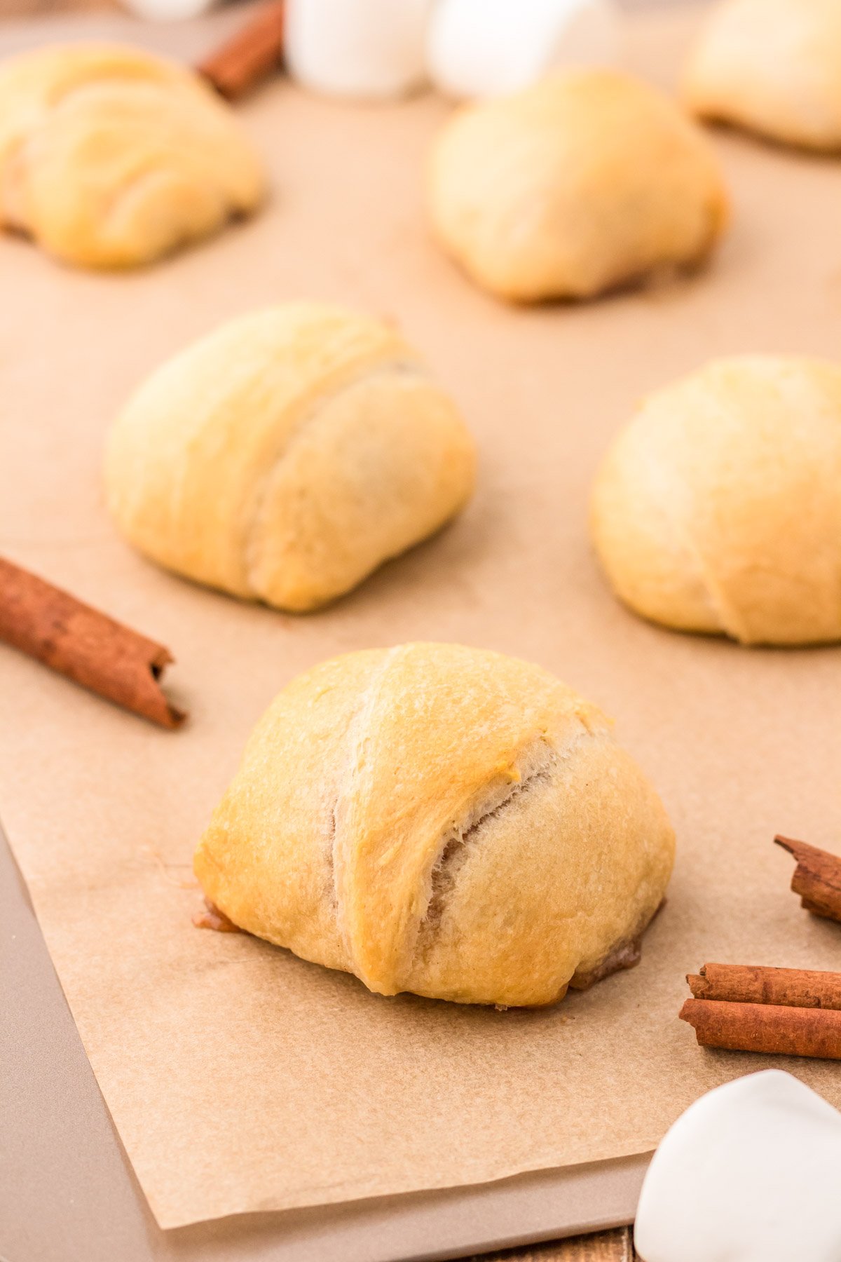 Baked Resurrection rolls on a baking sheet.