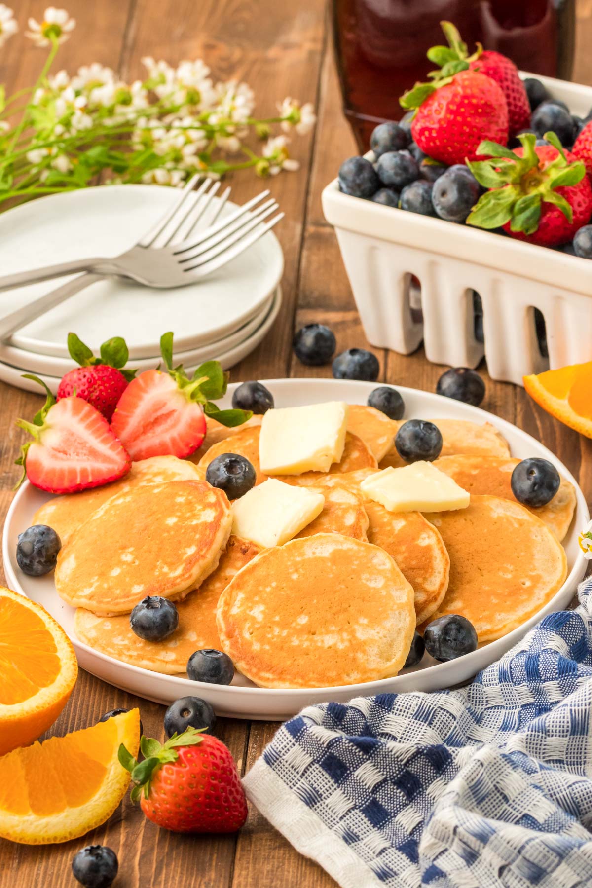 Silver dollar pancakes on a plate.