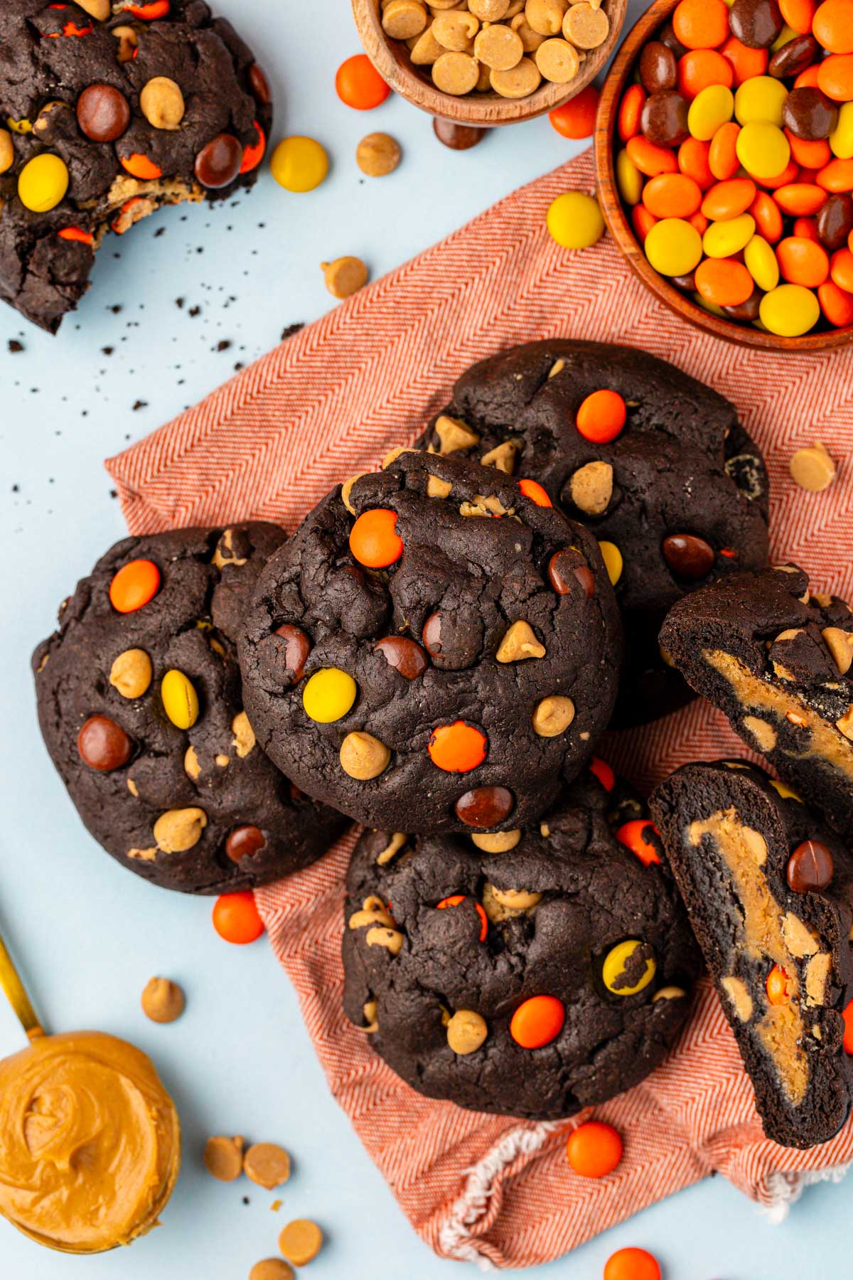 Overhead photo of chocolate cookies with peanut butter and Reese's Pieces.
