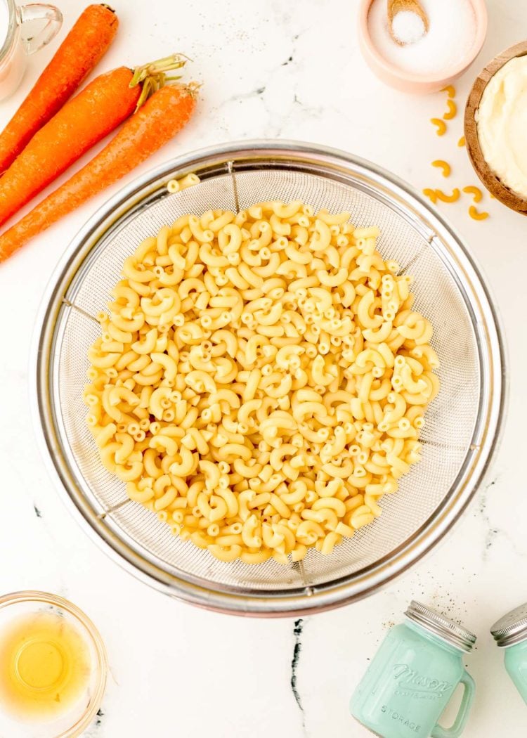 Macaroni in a strainer.