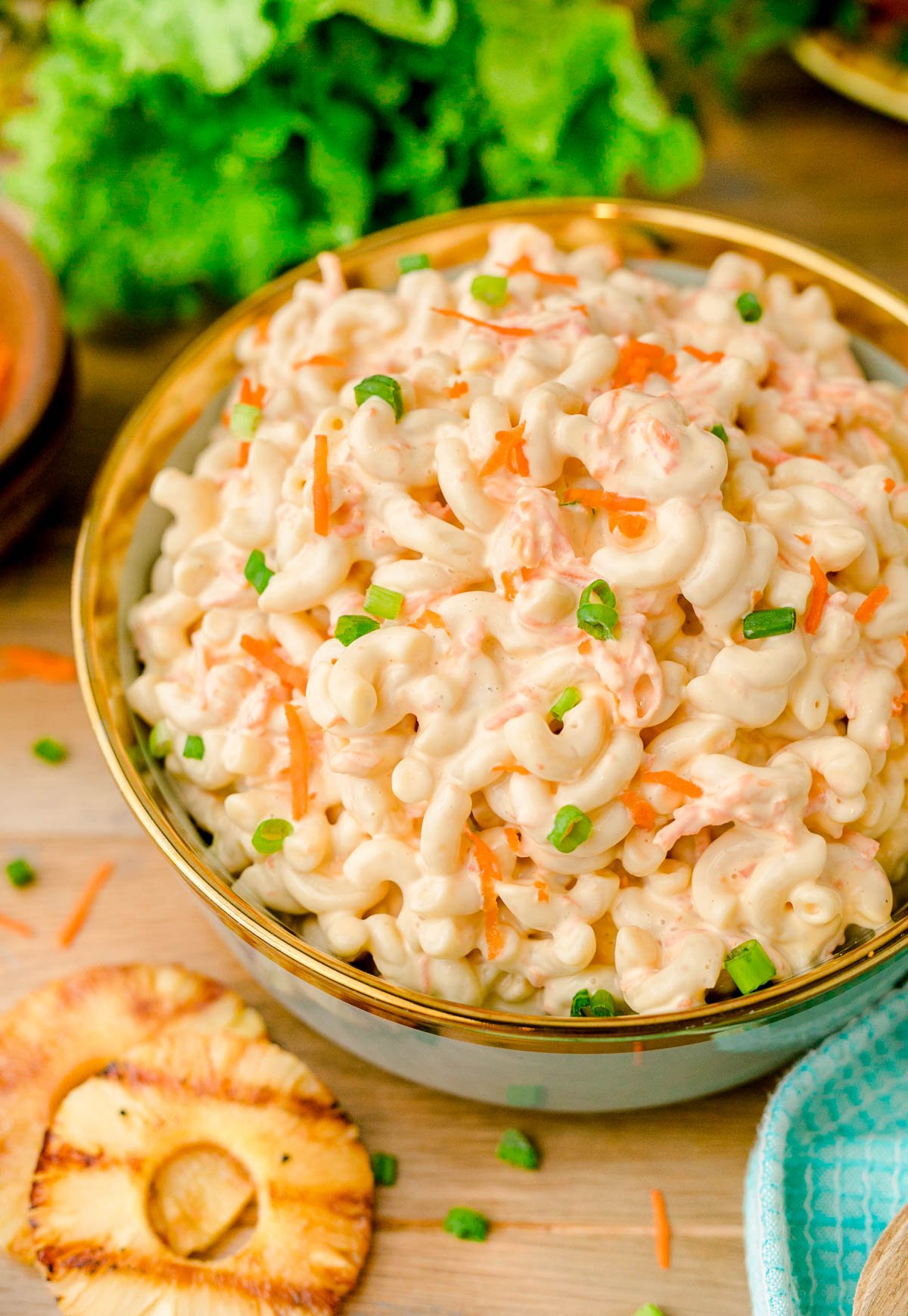 A bowl of Hawaiian macaroni salad on a wooden table.