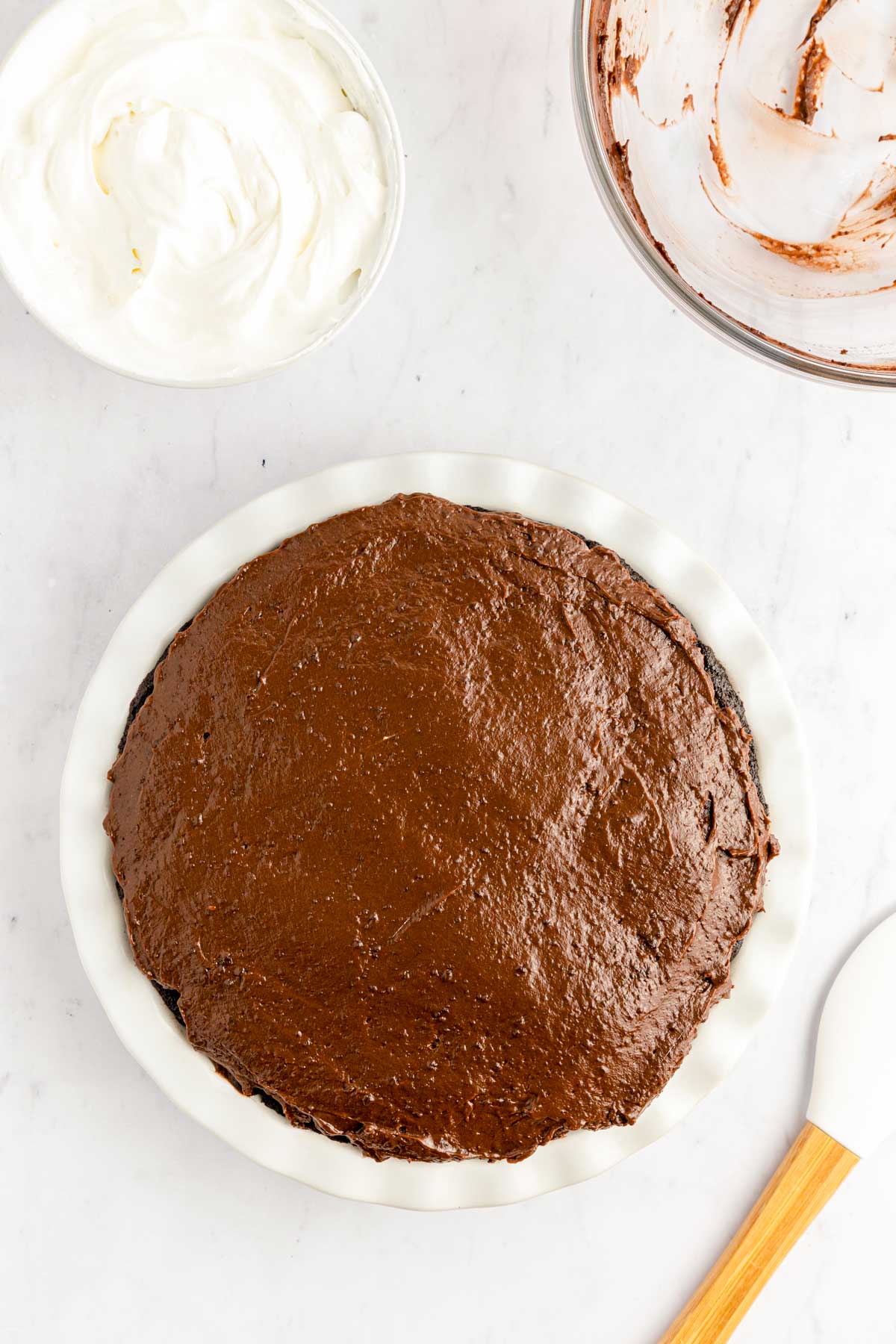 Chocolate pudding layer spread over a pie.