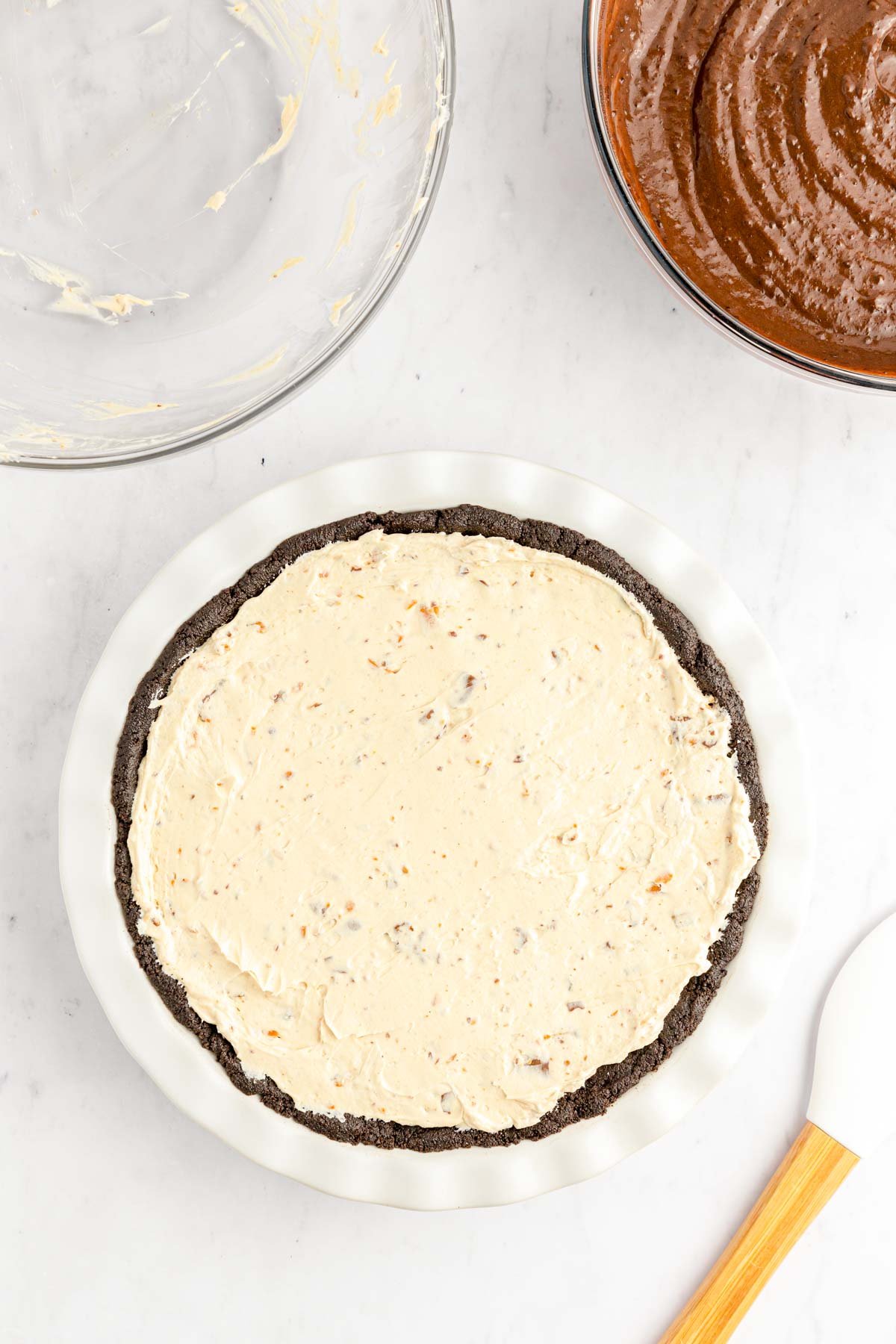 Butterfinger peanut butter pie filling in an oreo crust.