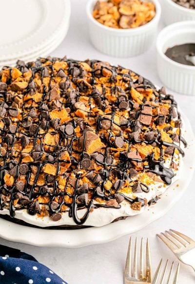 A butterfinger chocolate no-bake pie in a white baking dish.
