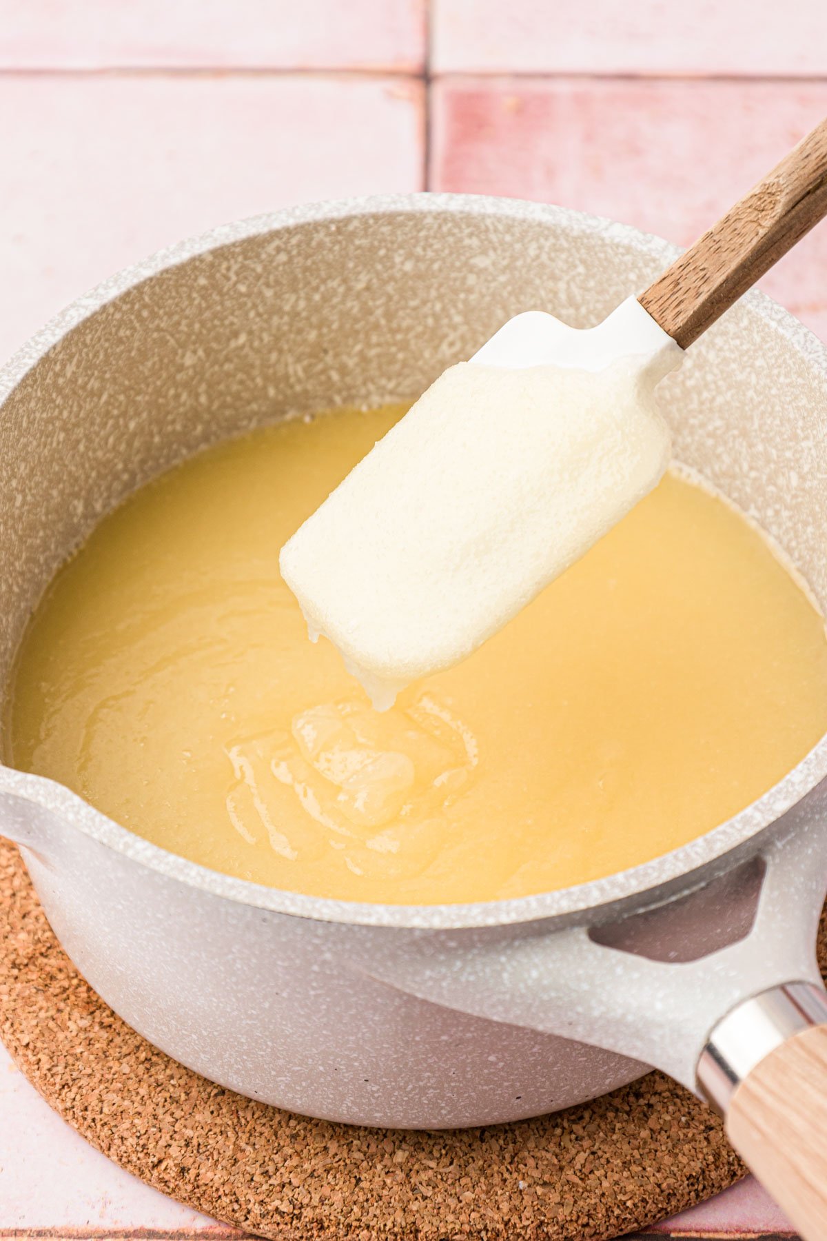 Butter and sugar being melted in a saucepan.
