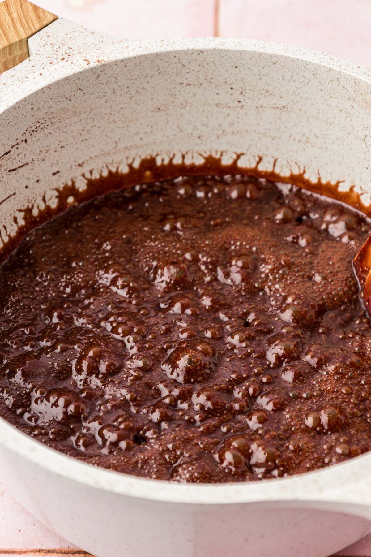 Chocolate no bake cookie mixture at a rolling boil.