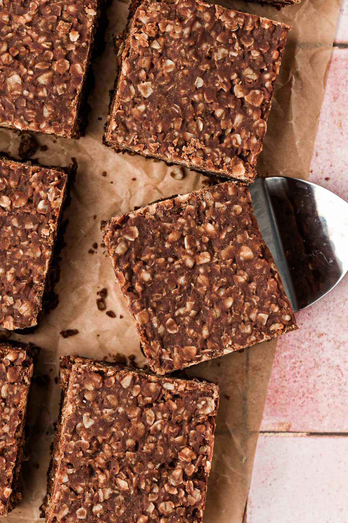 Overhead photo of no bake cookie brownies cut up on a table.