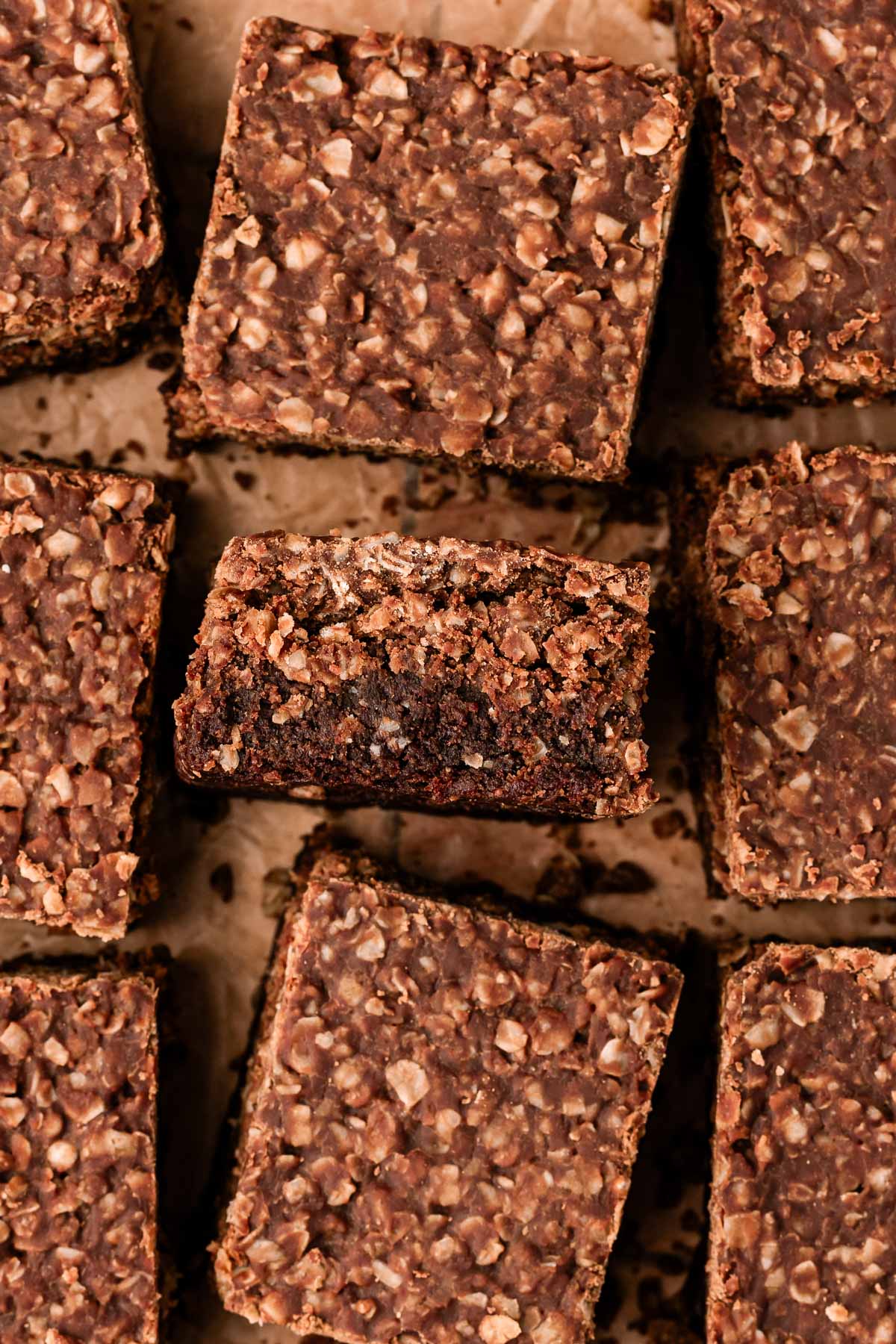 Overhead photo of no bake cookie brownies on a wooden cutting board.