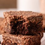 No Bake Cookie Brownies stacked with the top one missing a bite.