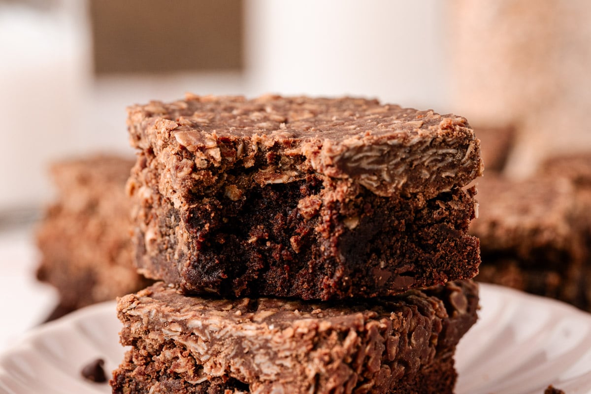 No Bake Cookie Brownies stacked with the top one missing a bite.