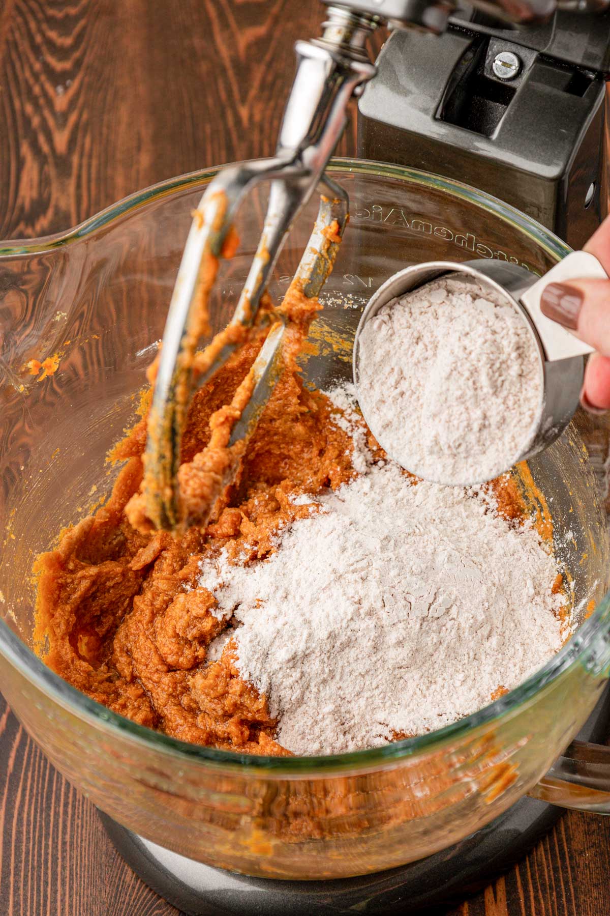 Dry ingredients being added to cookie dough.